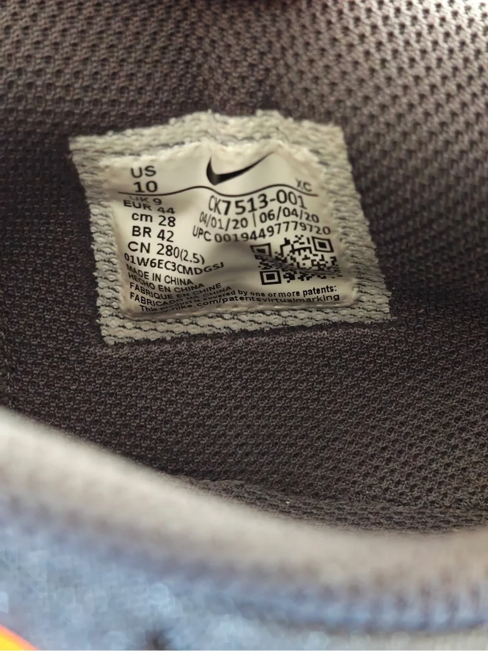 Nike Gray and Orange Athletic Sneakers with White Swoosh